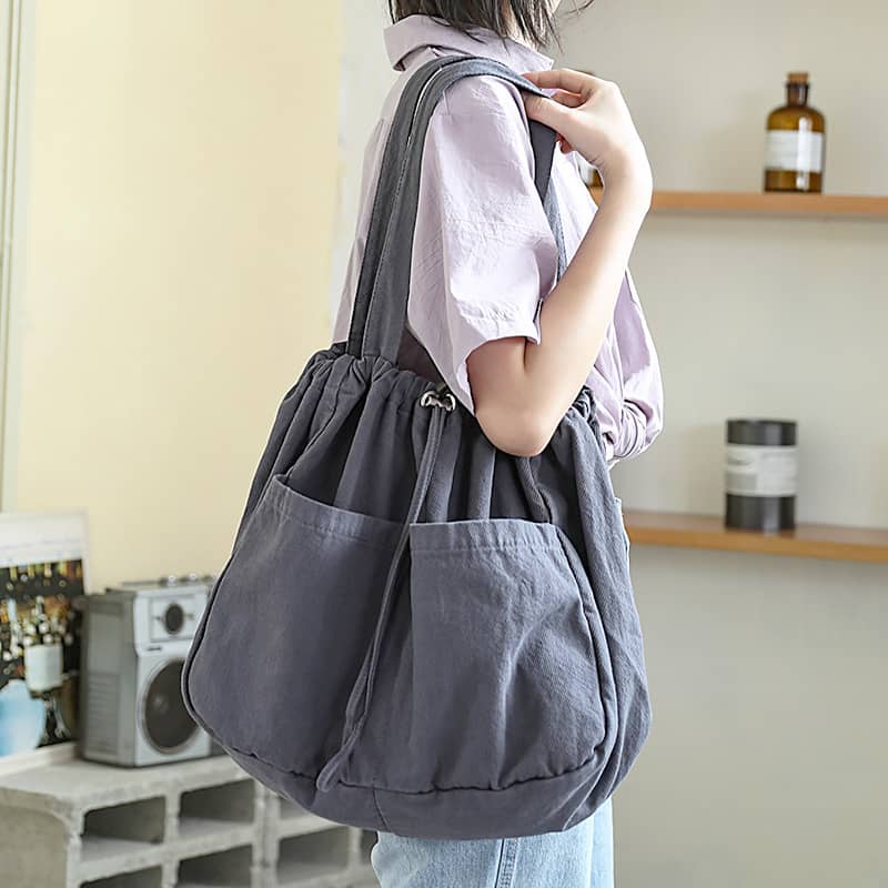 Canvas Shoulder Bag with Drawstring Closure and Single Strap Handle
