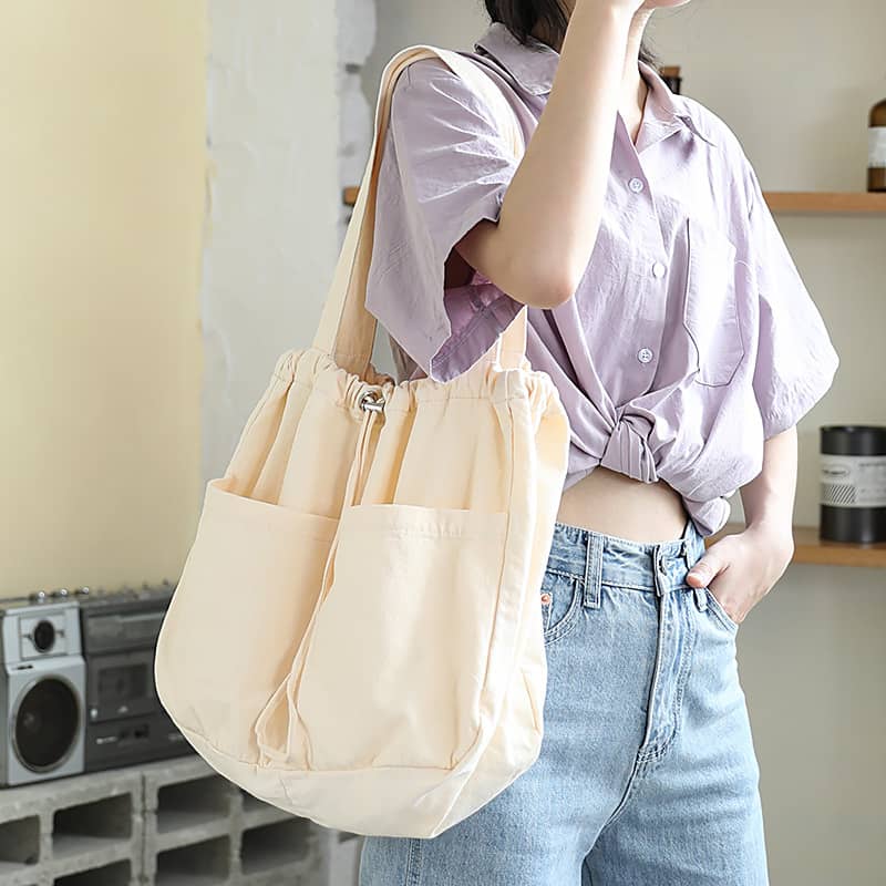 Canvas Shoulder Bag with Drawstring Closure and Single Strap Handle