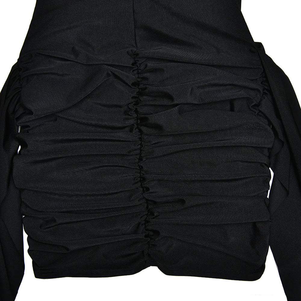 Black dress with ruched detailing on a white background #Color_Black