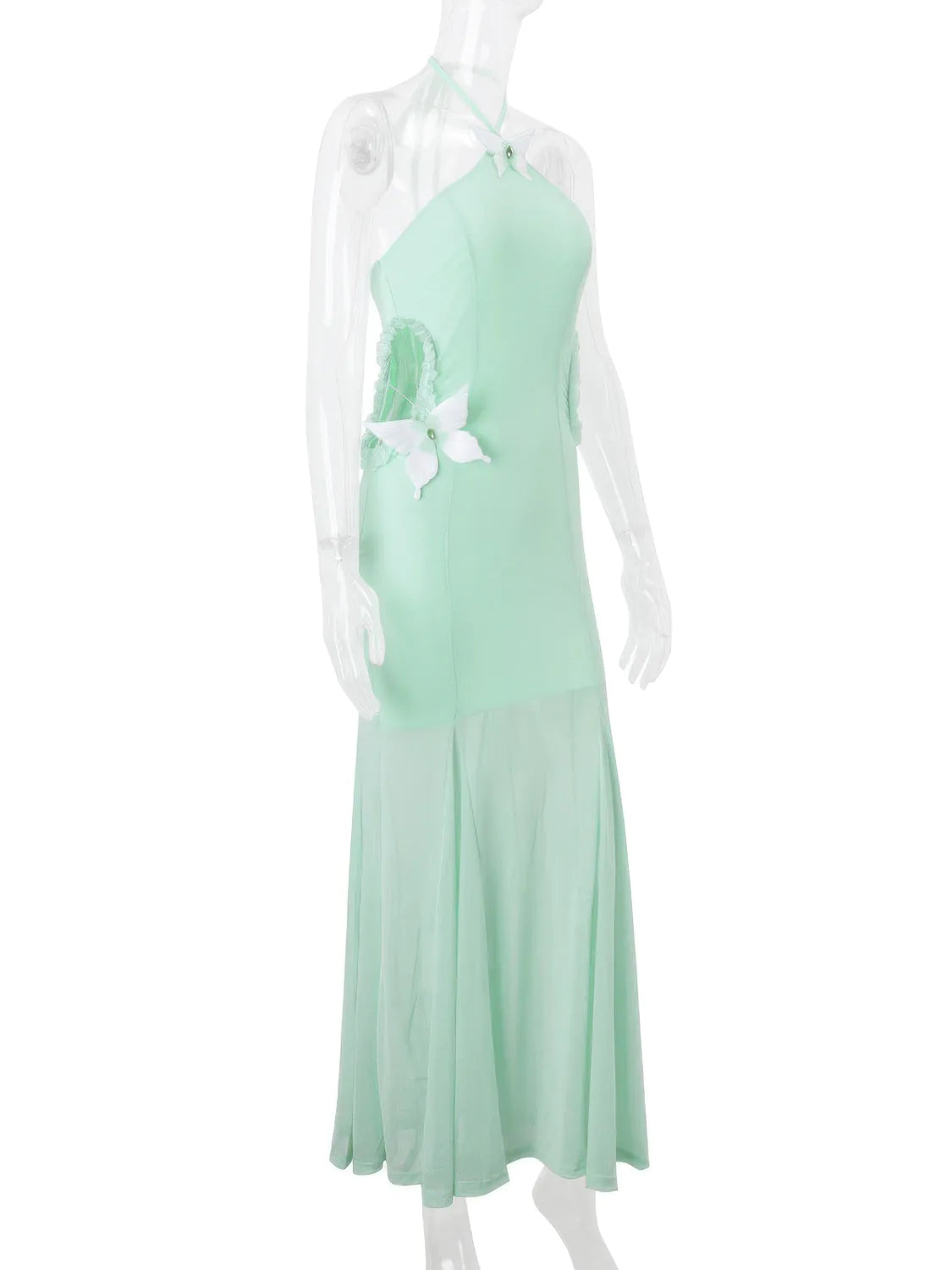 Mint green dress with floral details on a mannequin against a white background. #Color_Green