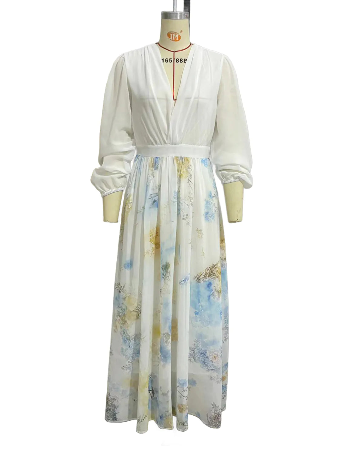 White dress with floral pattern on a mannequin against a white background