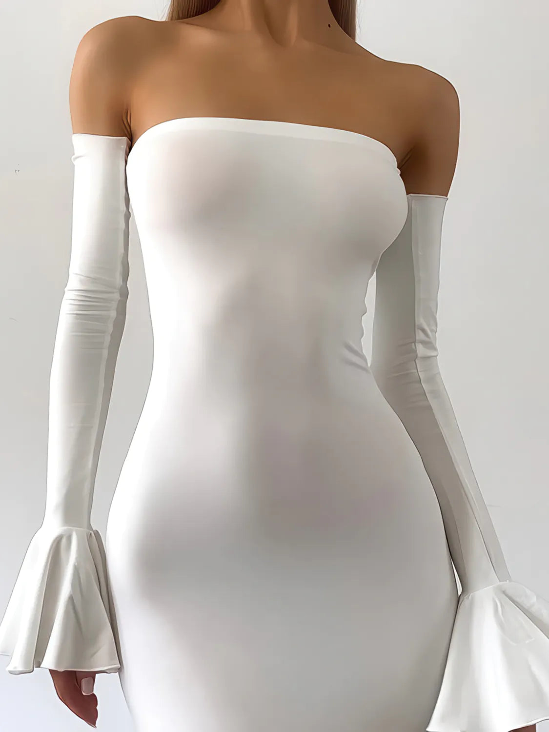 White off-shoulder dress with long sleeves on a plain background. #Color_White