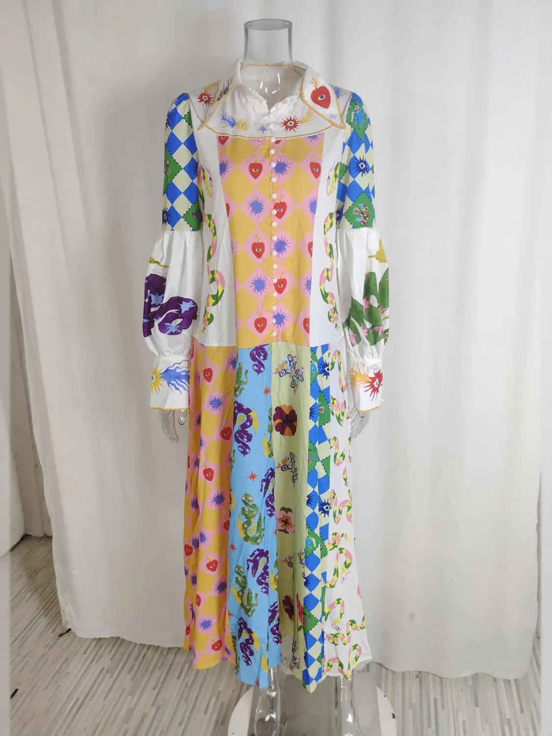 Colorful floral dress on a mannequin against a white curtain background. #Color_LightBlue