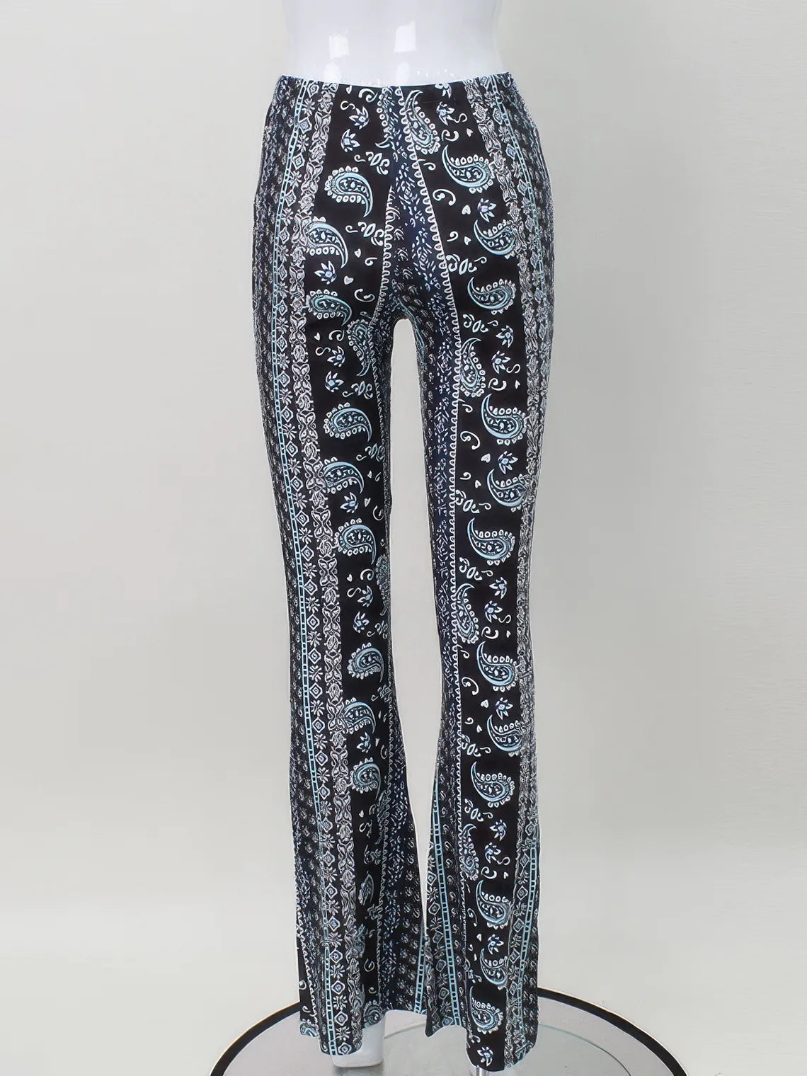 Black pants with white paisley pattern on a mannequin against a white background. #Color_Black