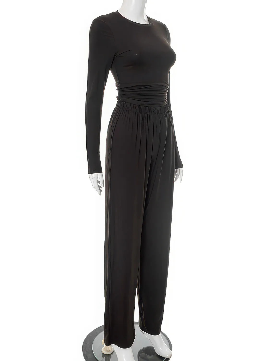 Black jumpsuit on a mannequin against a white background. #Color_Brown