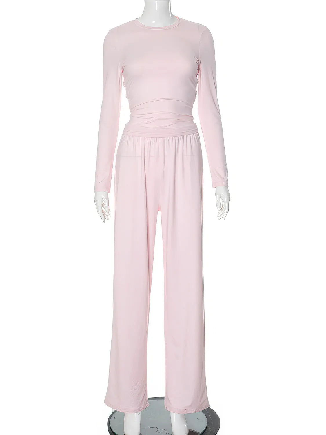 Pink jumpsuit on a mannequin against a white background. #Color_Pink